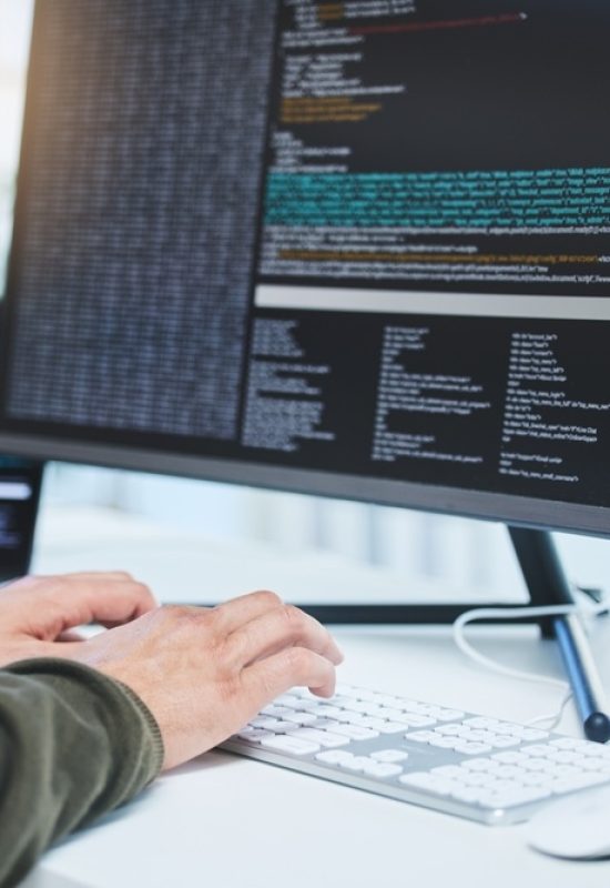 Programming, developer and hands on computer for coding, software script or cyber security in office. Closeup of IT technician person with technology for typing code, future and data analytics